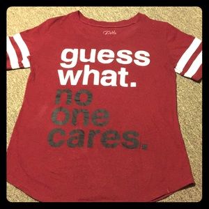 Maroon and white “Guess what. No one cares” shirt